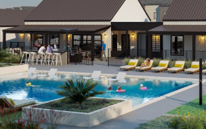Resort-style swimming pool with lounge seating