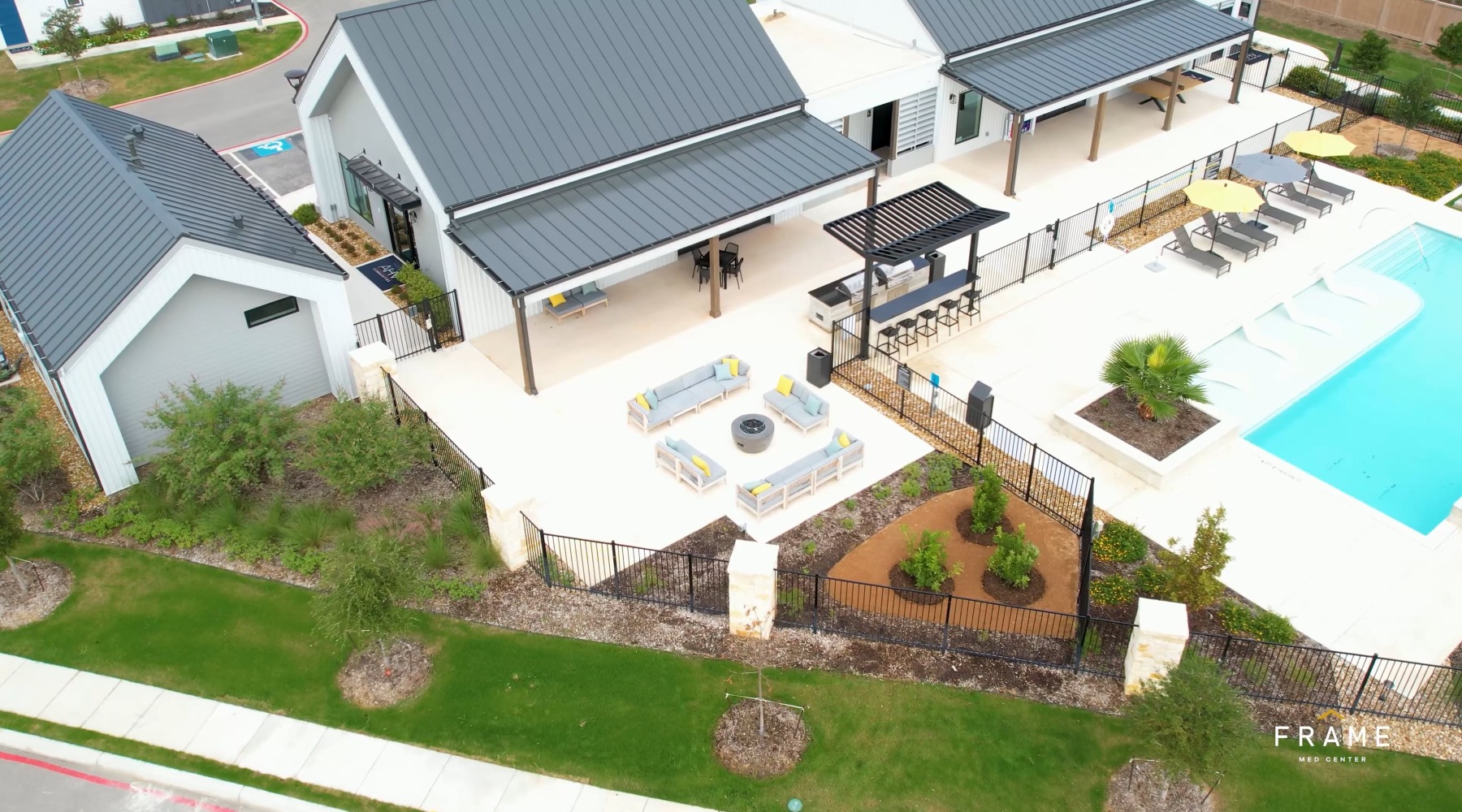 an aerial view of a courtyard with a pool